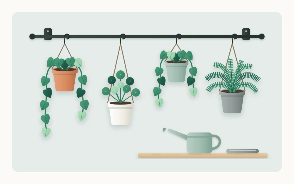 Horizontal rail on a pale wall with four small pots hanging from hooks at different heights, vines trailing from two of them