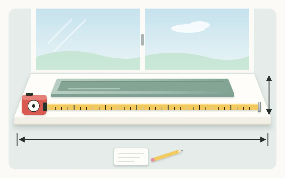 A bare windowsill with a retractable tape measure laid along it and an empty long narrow tray sitting on the windowsill